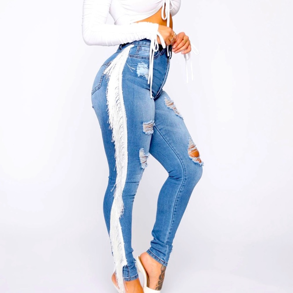 High rise medium wash jeans with fringe